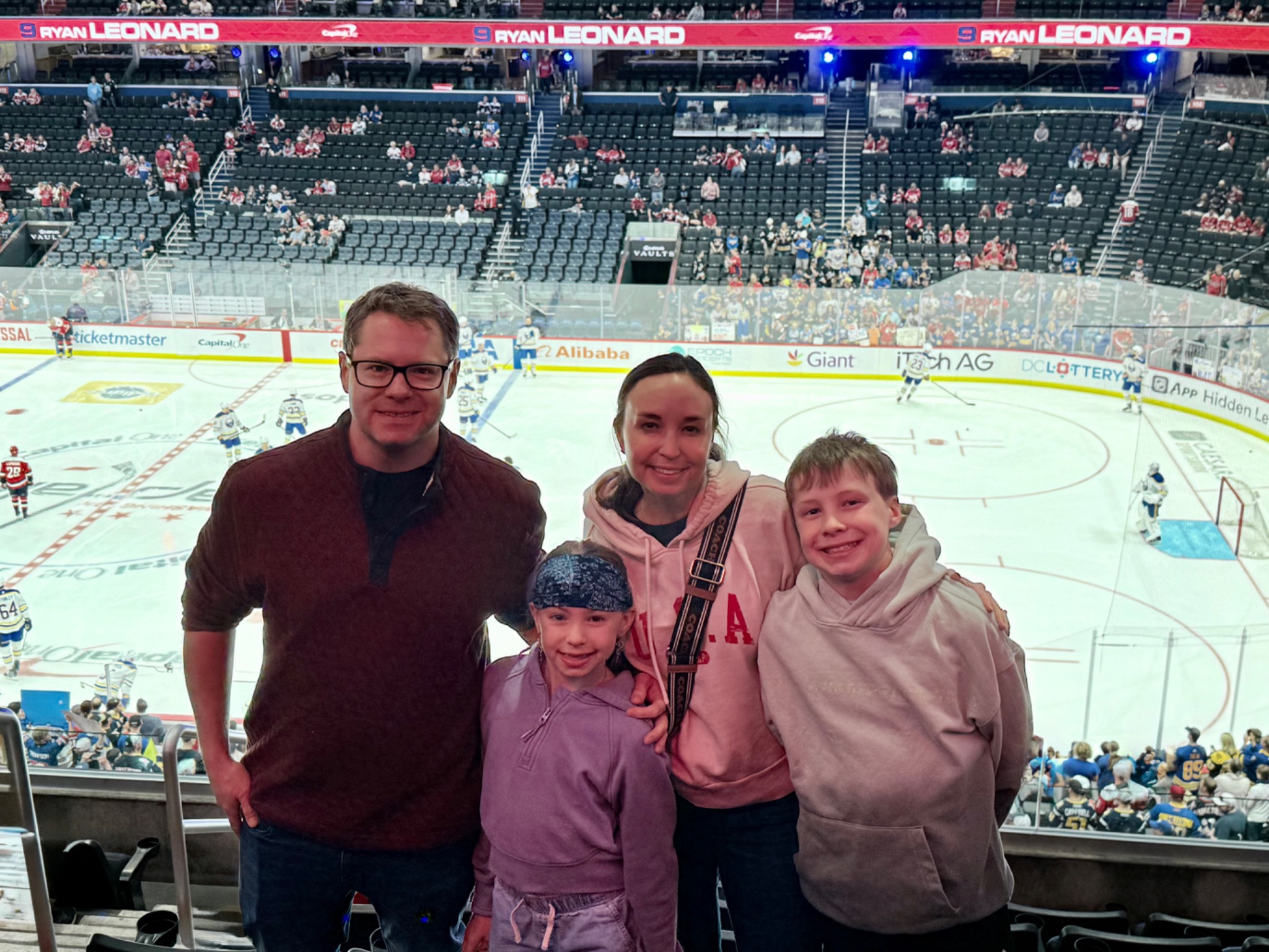 Family attending a Washington Capitals hockey game during a spring break trip to Washington DC