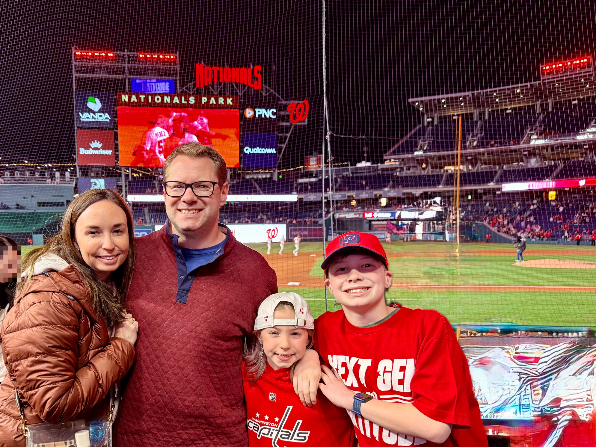 Family attending a Washington Nationals baseball game during a Washington DC trip