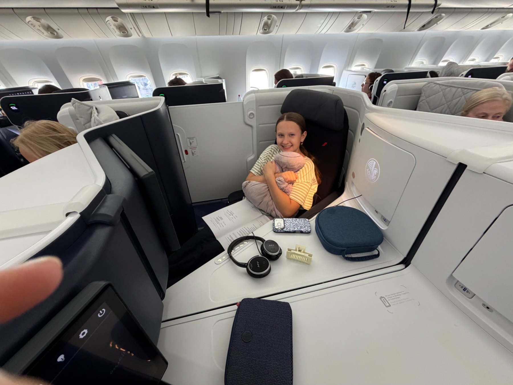 Kim's daughter in an Air France business class seat