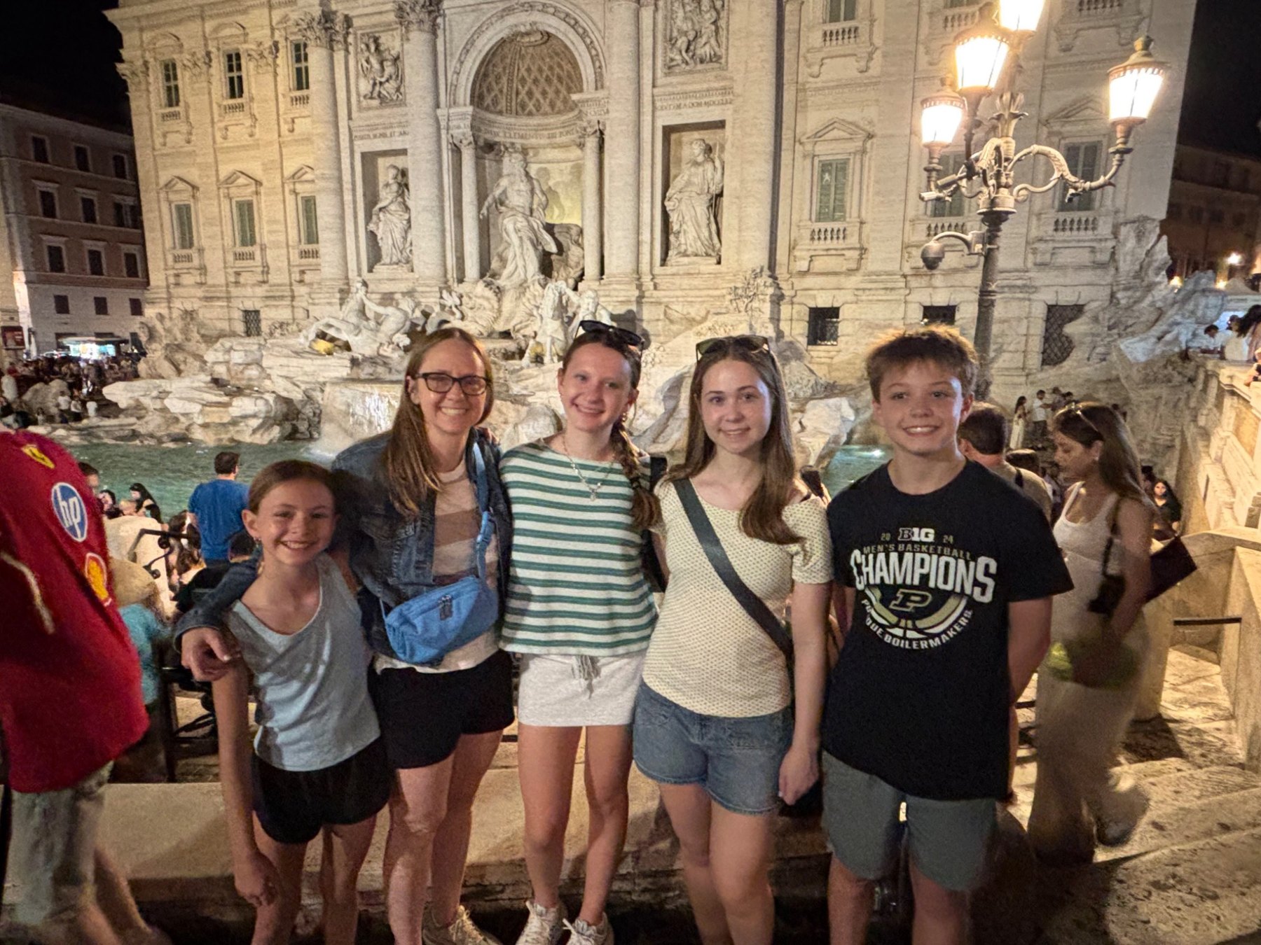 Kim and her family at the Trevi Fountain in Rome
